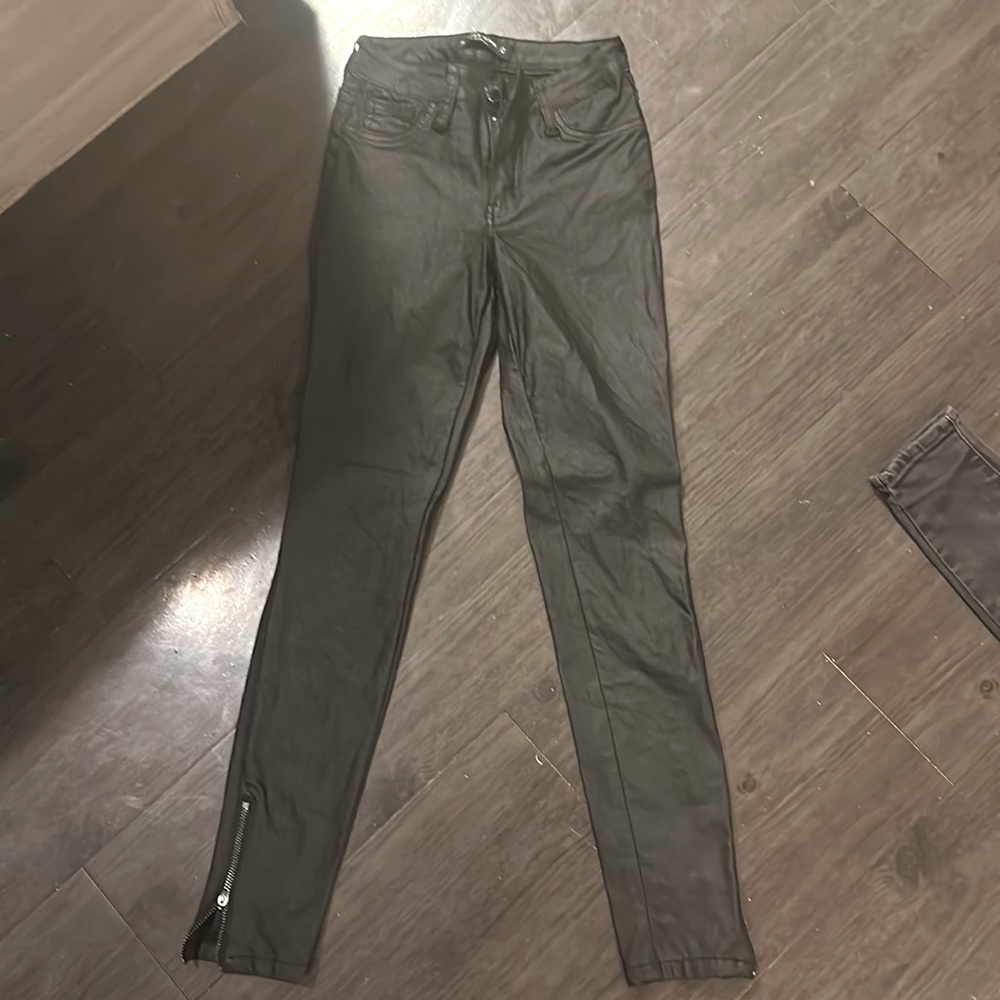 LIKE NEW: wax coated black pants. Size 24.